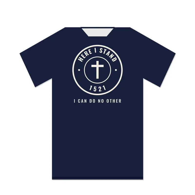 Back of a navy T-shirt with a large round badge reading HERE I STAND and 1521 around a cross, above the words I CAN DO NO OTHER.